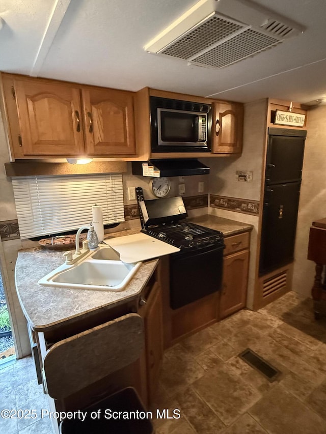 10 Lazy Squaw Trl, Gouldsboro, PA 18424 - kitchen with gas range oven, ventilation hood, and brown cabinetry