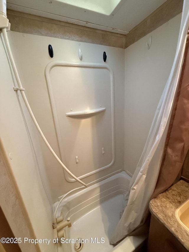 10 Lazy Squaw Trl, Gouldsboro, PA 18424 - bathroom view of shower / bath combo with shower curtain and vanity