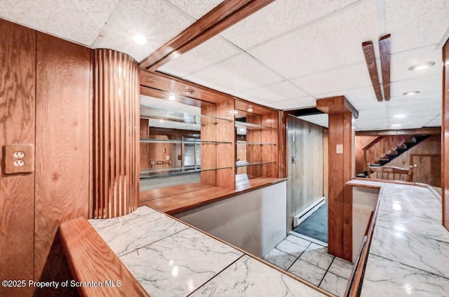 1614 Jefferson Ave, Dunmore, PA 18509 - bar featuring wood walls, baseboard heating, stairway, and marble finish floors