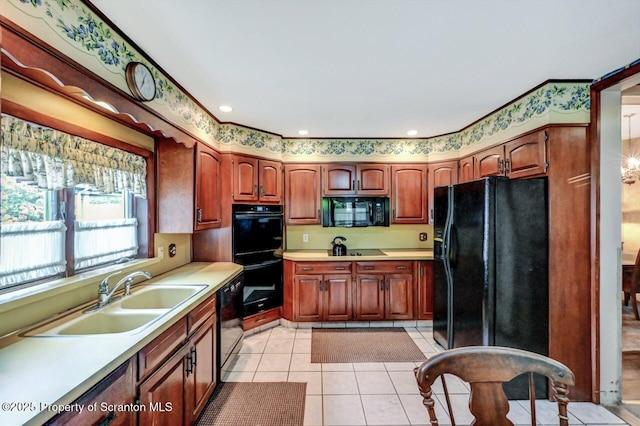 1614 Jefferson Ave, Dunmore, PA 18509 - kitchen featuring black appliances, a sink, light countertops, and light tile patterned floors