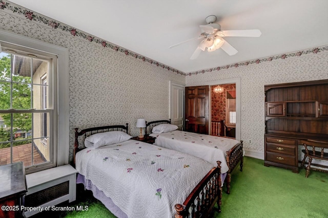 1614 Jefferson Ave, Dunmore, PA 18509 - carpeted bedroom with wallpapered walls and ceiling fan