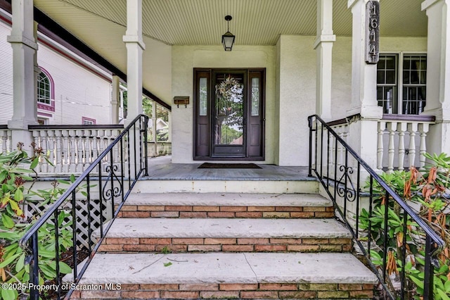 1614 Jefferson Ave, Dunmore, PA 18509 - entrance to property with covered porch and stucco siding