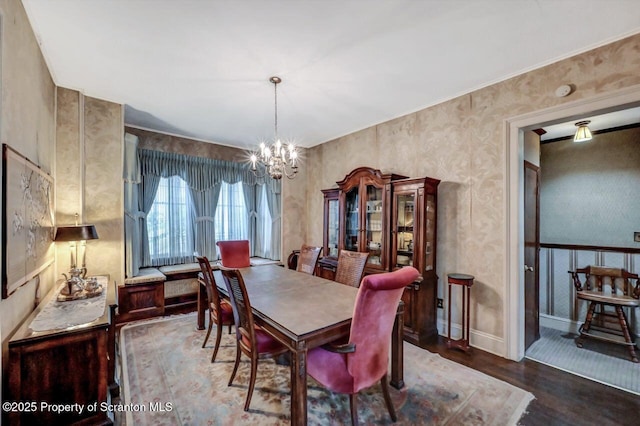 1614 Jefferson Ave, Dunmore, PA 18509 - dining room with a chandelier, wood finished floors, and baseboards