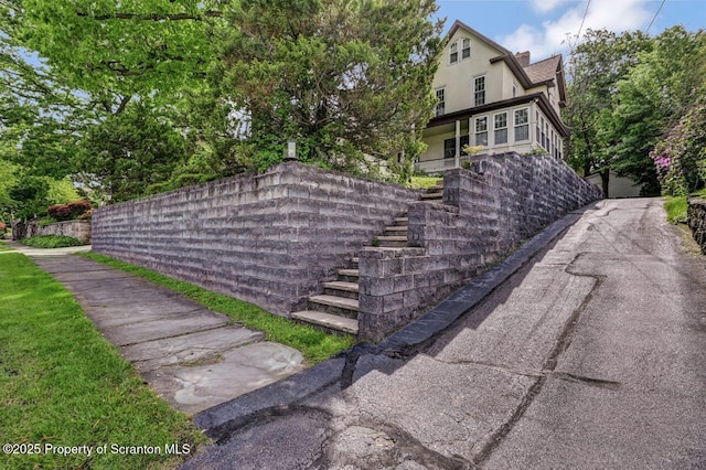 1614 Jefferson Ave, Dunmore, PA 18509 - view of side of home with stairs and stucco siding