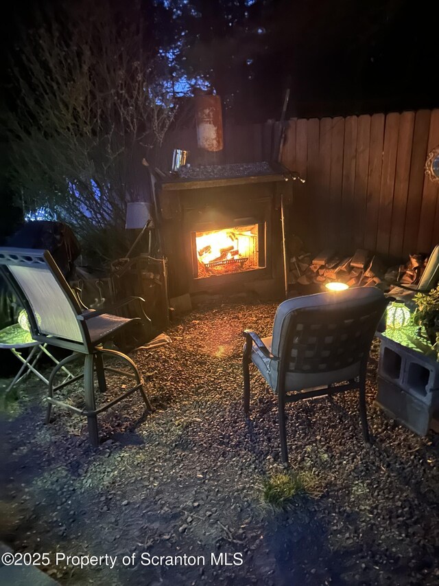 2119 Vacation Ln, Pocono Summit, PA 18346 - yard at twilight with a lit fireplace