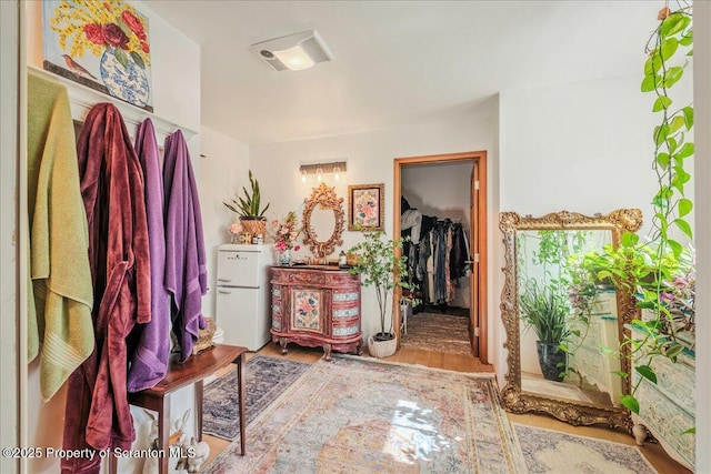 2119 Vacation Ln, Pocono Summit, PA 18346 - bathroom with wood finished floors and a walk in closet