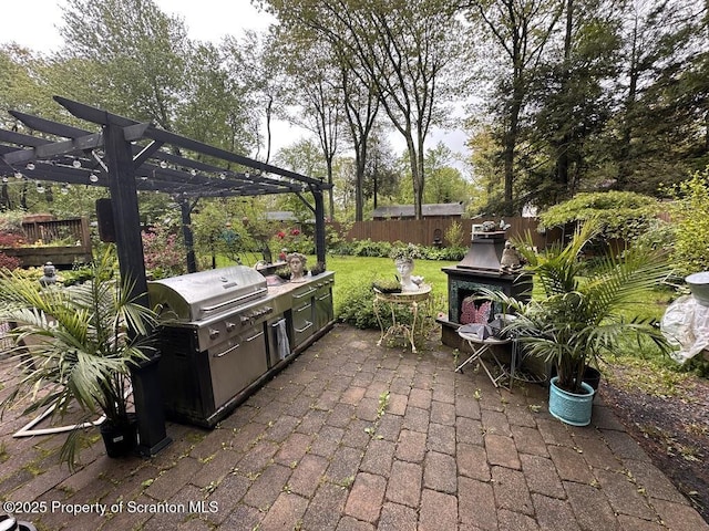2119 Vacation Ln, Pocono Summit, PA 18346 - view of patio featuring a pergola and an outdoor kitchen