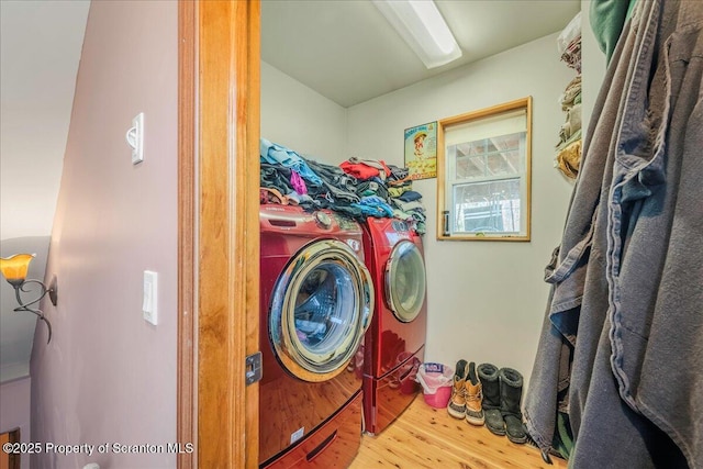 2119 Vacation Ln, Pocono Summit, PA 18346 - washroom featuring washer and clothes dryer and wood finished floors