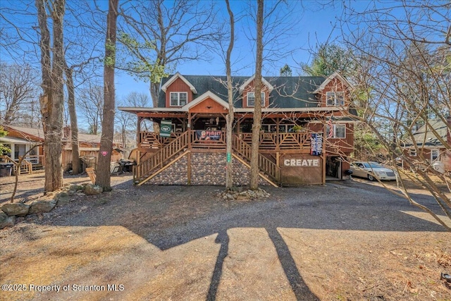 2119 Vacation Ln, Pocono Summit, PA 18346 - view of front facade with stairs and a porch