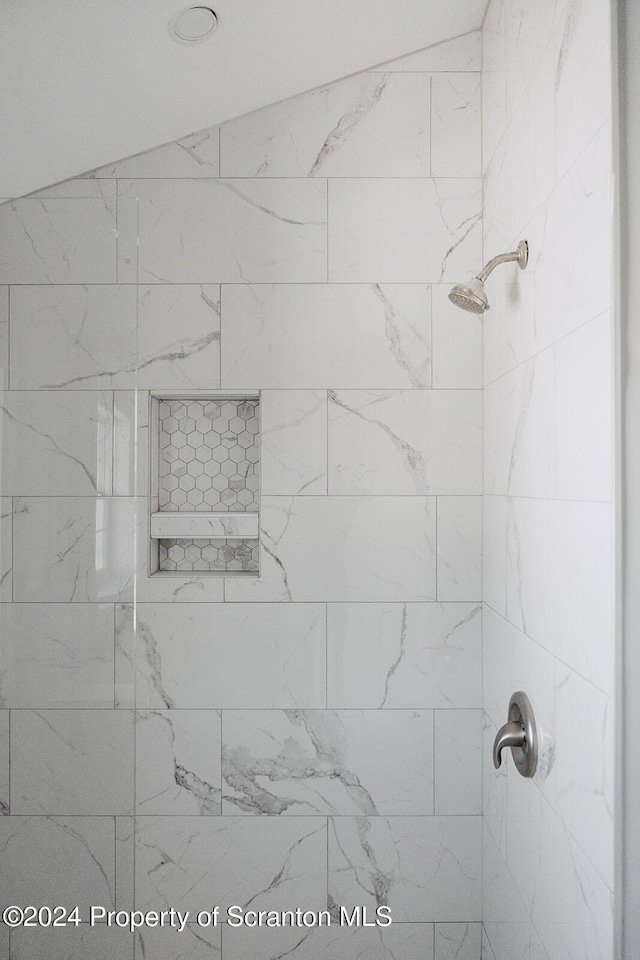 details with a tile shower