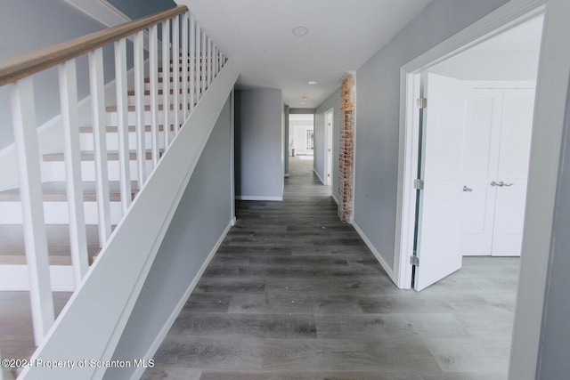 hall with dark hardwood / wood-style floors