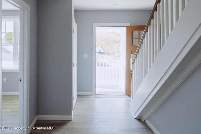 entryway with light hardwood / wood-style floors