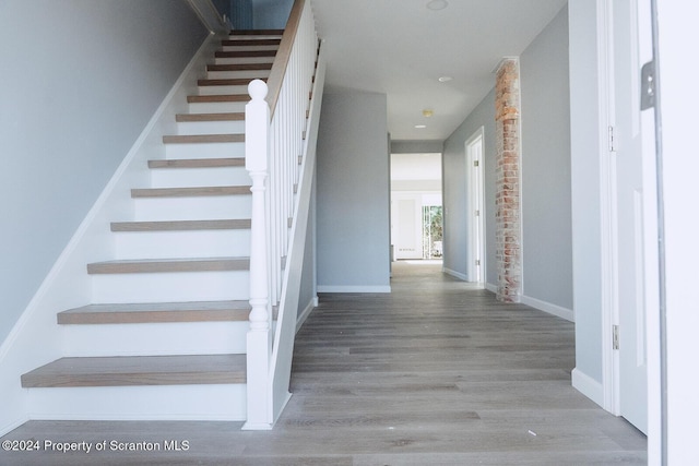 stairway with wood-type flooring