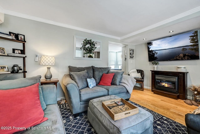 living room featuring hardwood / wood-style floors and ornamental molding