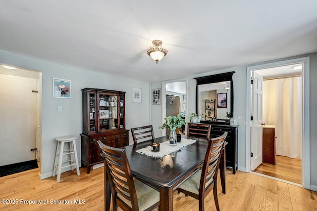 dining room with light wood-type flooring