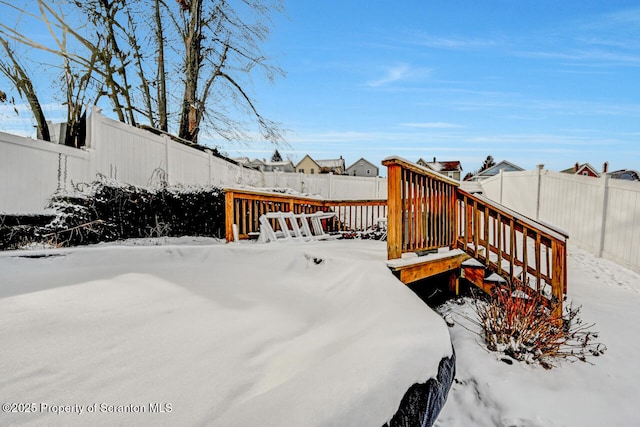 view of snow covered deck