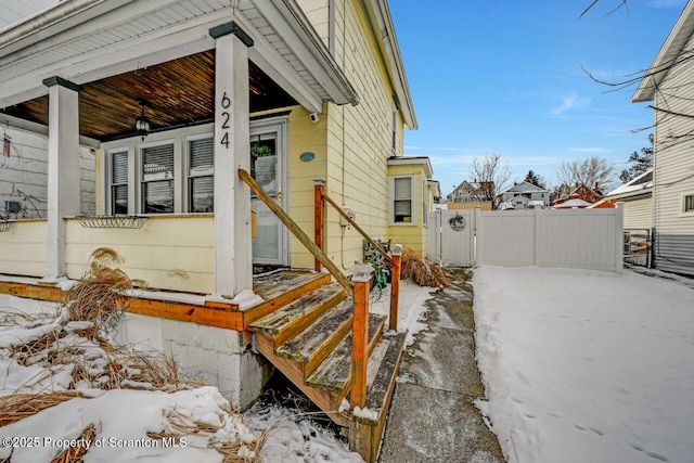 exterior space with a porch, a gate, and fence