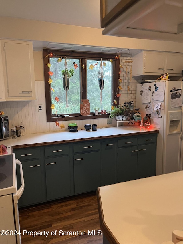 kitchen with white cabinetry, range, white refrigerator with ice dispenser, and dark wood-type flooring