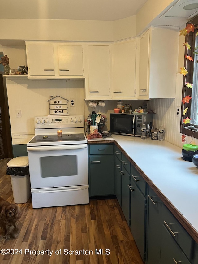 kitchen with dark wood-type flooring, white cabinets, and electric stove