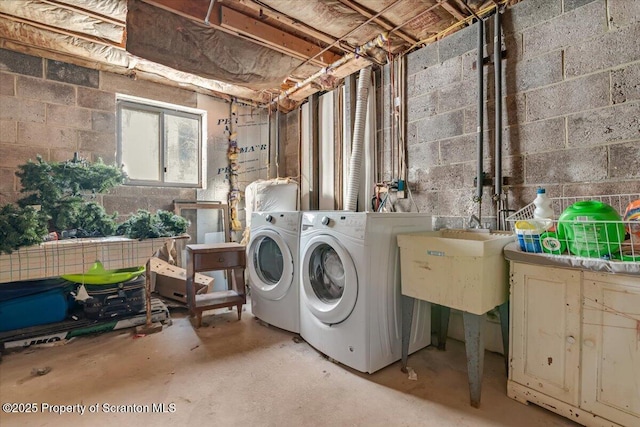 clothes washing area with independent washer and dryer