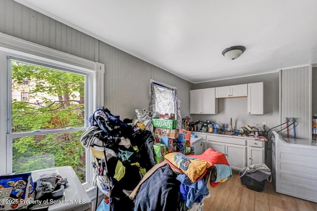 612 Farber Ct, Scranton, PA 18510 - kitchen with wood finished floors, white cabinetry, and light countertops
