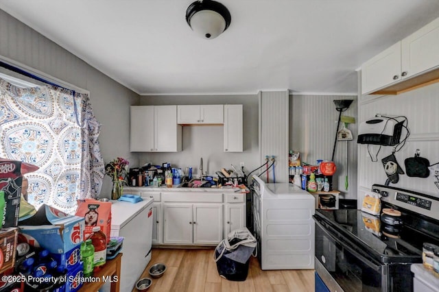 612 Farber Ct, Scranton, PA 18510 - kitchen with stainless steel electric range oven, white cabinetry, light wood-style flooring, light countertops, and crown molding
