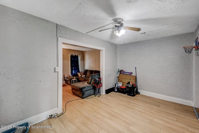 612 Farber Ct, Scranton, PA 18510 - empty room with a textured wall, a ceiling fan, wood finished floors, and a textured ceiling