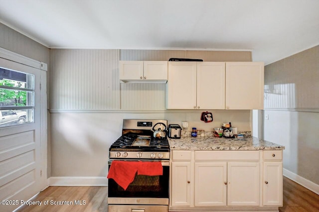 612 Farber Ct, Scranton, PA 18510 - kitchen featuring gas range, light wood-type flooring, light stone counters, and white cabinetry
