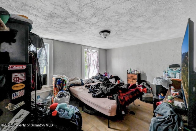 612 Farber Ct, Scranton, PA 18510 - bedroom featuring a textured ceiling, wood finished floors, and a textured wall