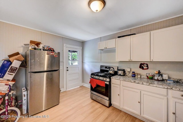 612 Farber Ct, Scranton, PA 18510 - kitchen featuring stainless steel appliances, crown molding, light wood-type flooring, white cabinetry, and light stone counters
