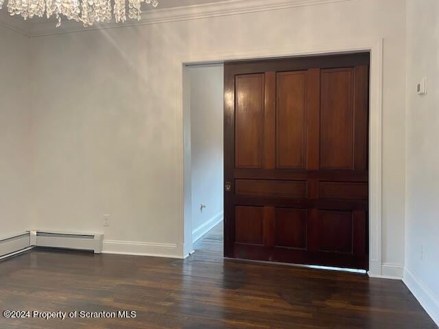 interior space with a notable chandelier and dark wood-type flooring