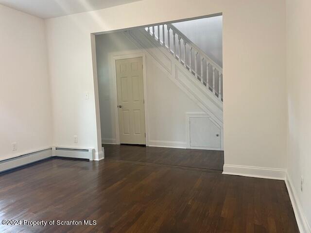 interior space featuring dark hardwood / wood-style floors and a baseboard radiator