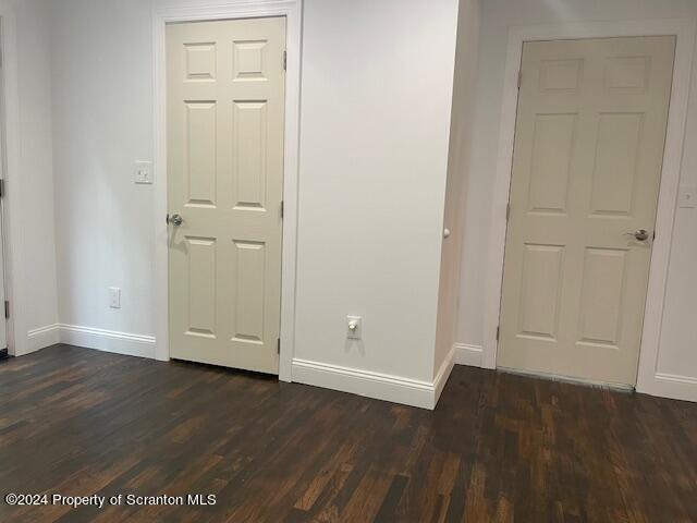 interior space featuring dark wood-type flooring