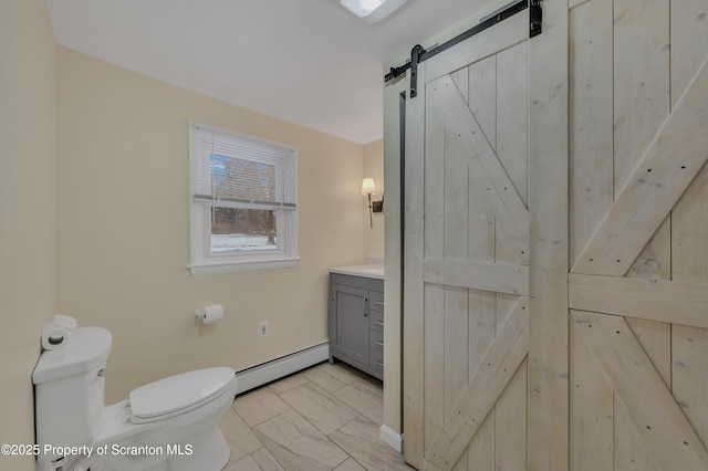 bathroom with a baseboard heating unit, vanity, toilet, and vaulted ceiling