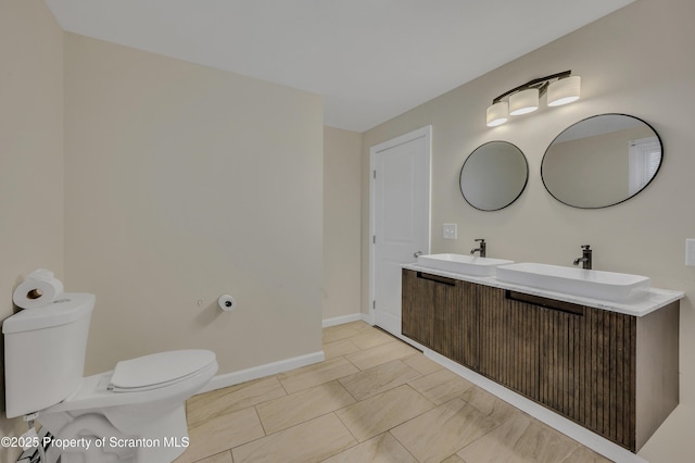 bathroom with toilet and vanity