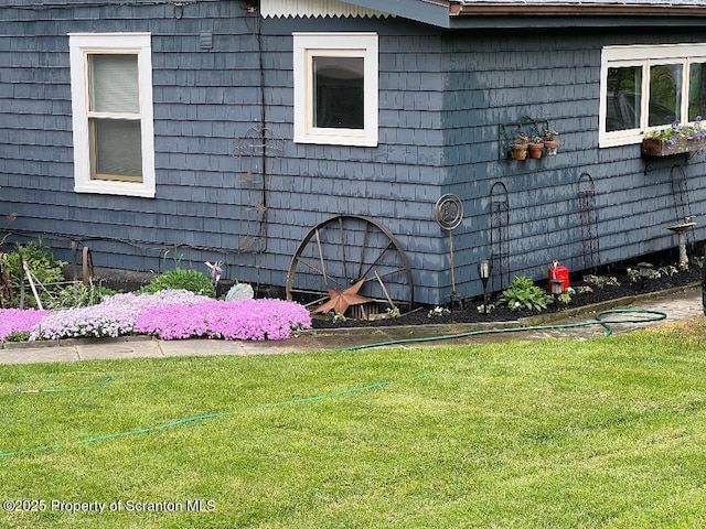 view of property exterior featuring a yard