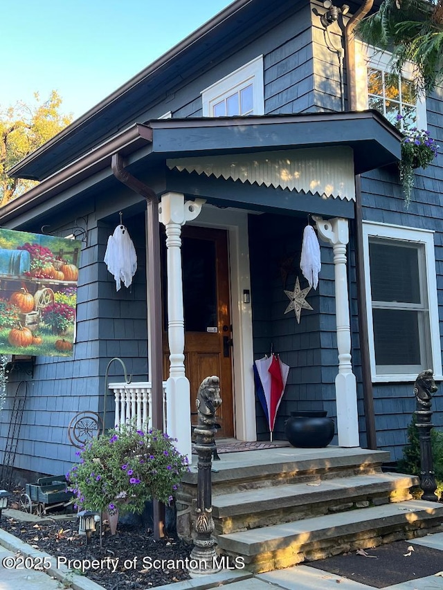 property entrance with covered porch