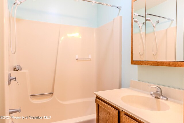 bathroom with vanity and shower / tub combination