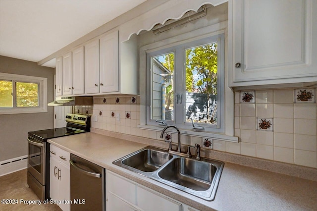 kitchen featuring sink, white cabinetry, backsplash, stainless steel appliances, and a baseboard heating unit