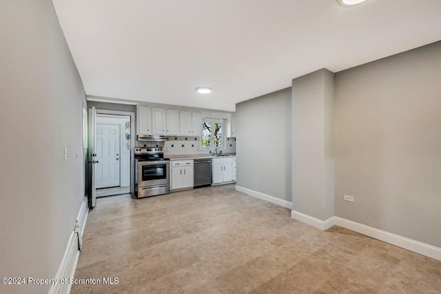 1319 Pine St, Scranton, PA 18510 - kitchen with appliances with stainless steel finishes, light countertops, under cabinet range hood, backsplash, and white cabinetry