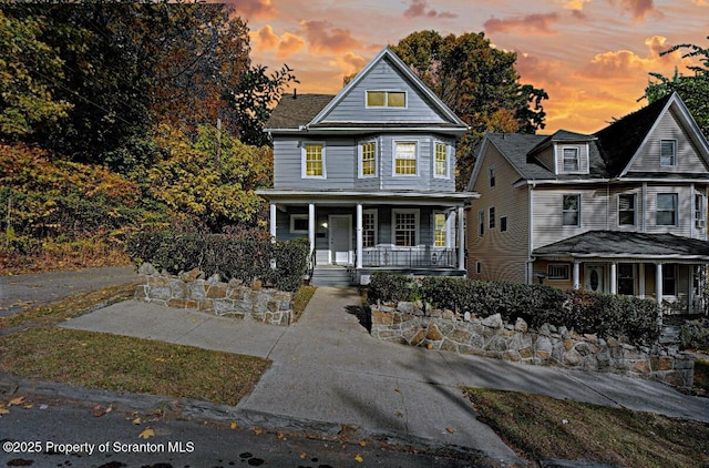 view of property with a porch