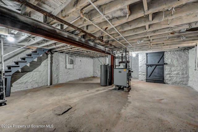 1319 Pine St, Scranton, PA 18510 - unfinished below grade area with gas water heater, stairway, and a heating unit