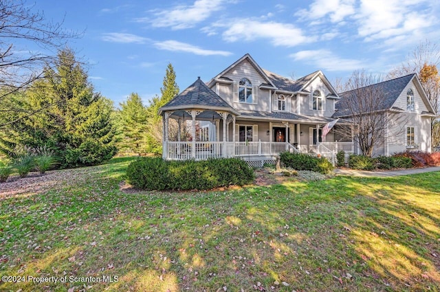 view of front facade with a porch and a front yard