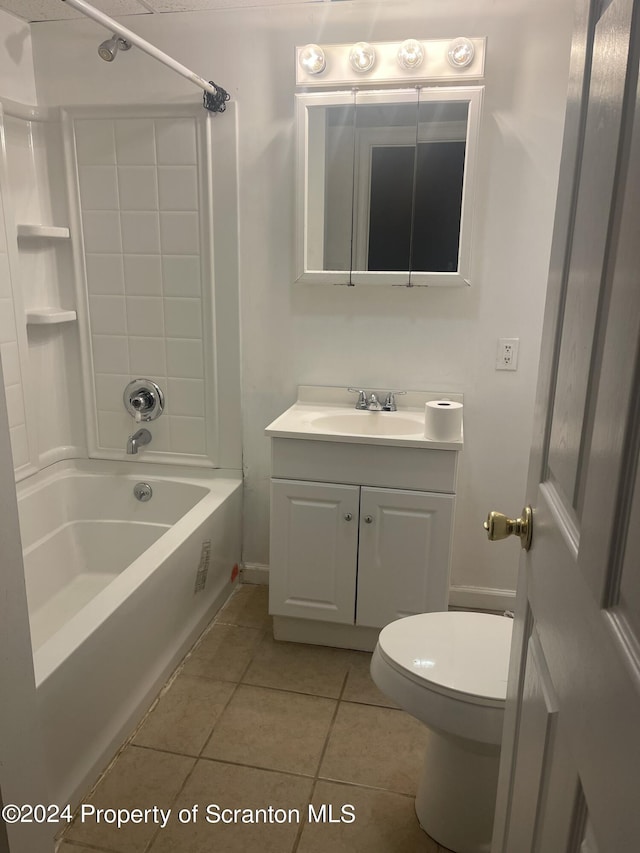 full bathroom with toilet, vanity, tile patterned floors, and  shower combination