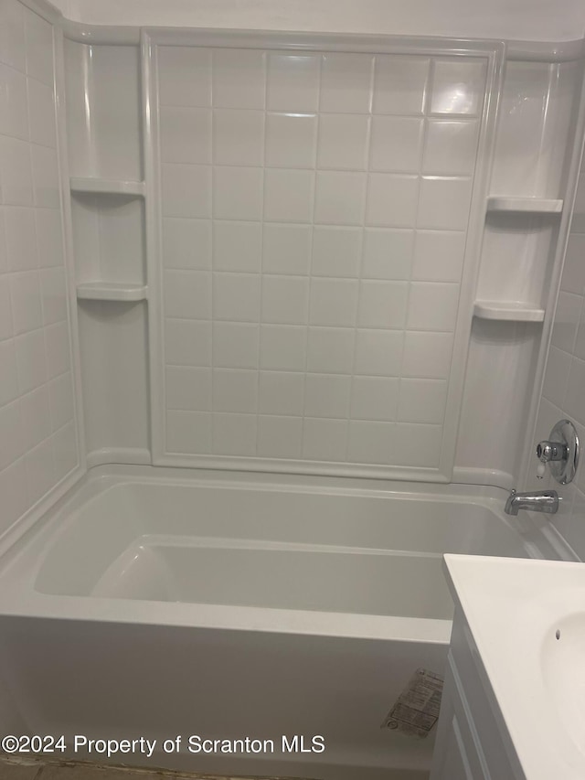 bathroom featuring shower / bathtub combination and vanity