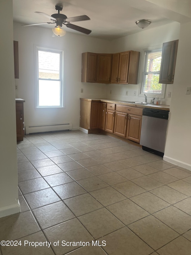 kitchen with baseboard heating, light tile patterned floors, stainless steel dishwasher, and ceiling fan