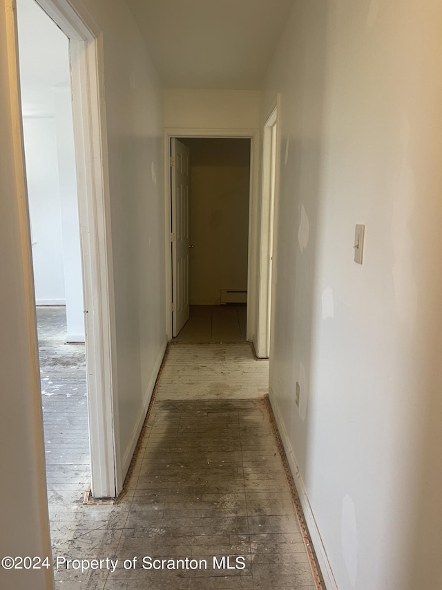 corridor with baseboard heating