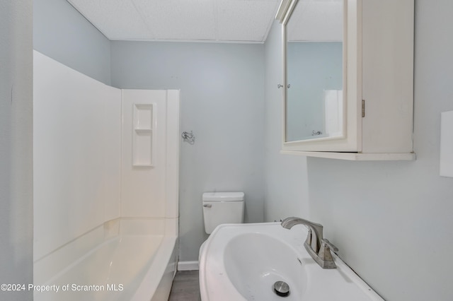 full bathroom featuring shower / bath combination, toilet, and sink