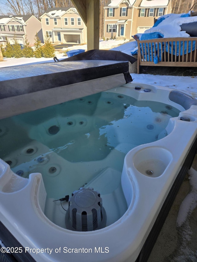 exterior space featuring a jacuzzi