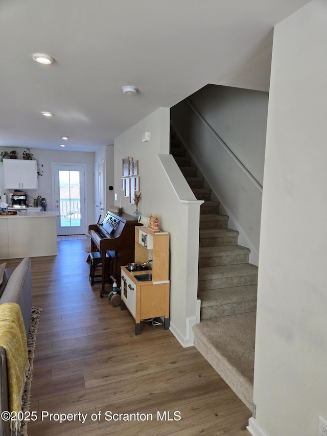 stairway with wood-type flooring